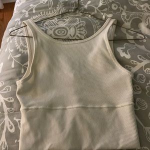 Worn once power pivot tank! Cream color size 4!